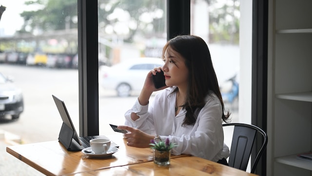 Woman contemplating home security systems